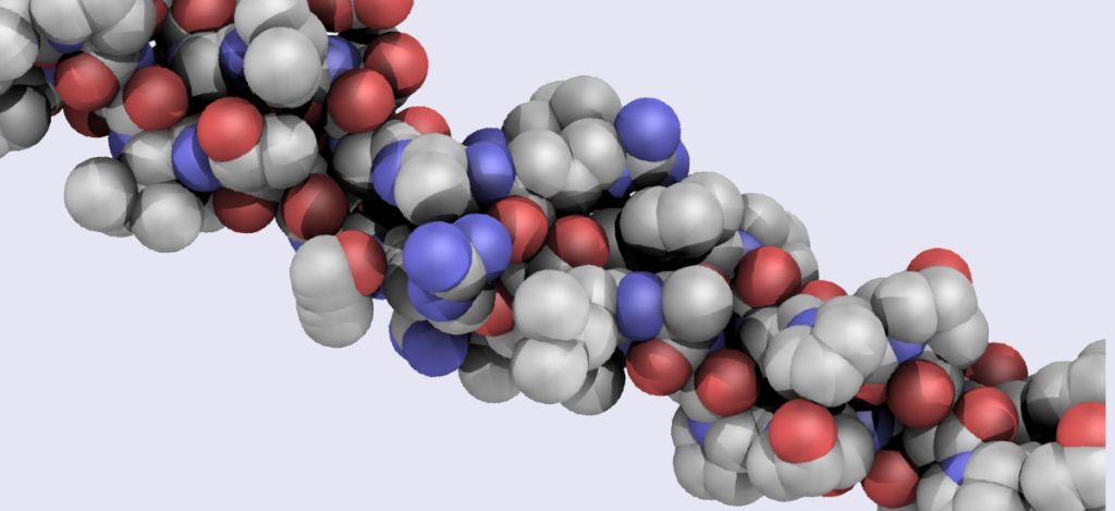 Model molekularny przedstawiający strukturę biomolekuły, z wyraźnym uwidocznieniem atomów w różnych kolorach, co ilustruje ich różnorodność chemiczną.